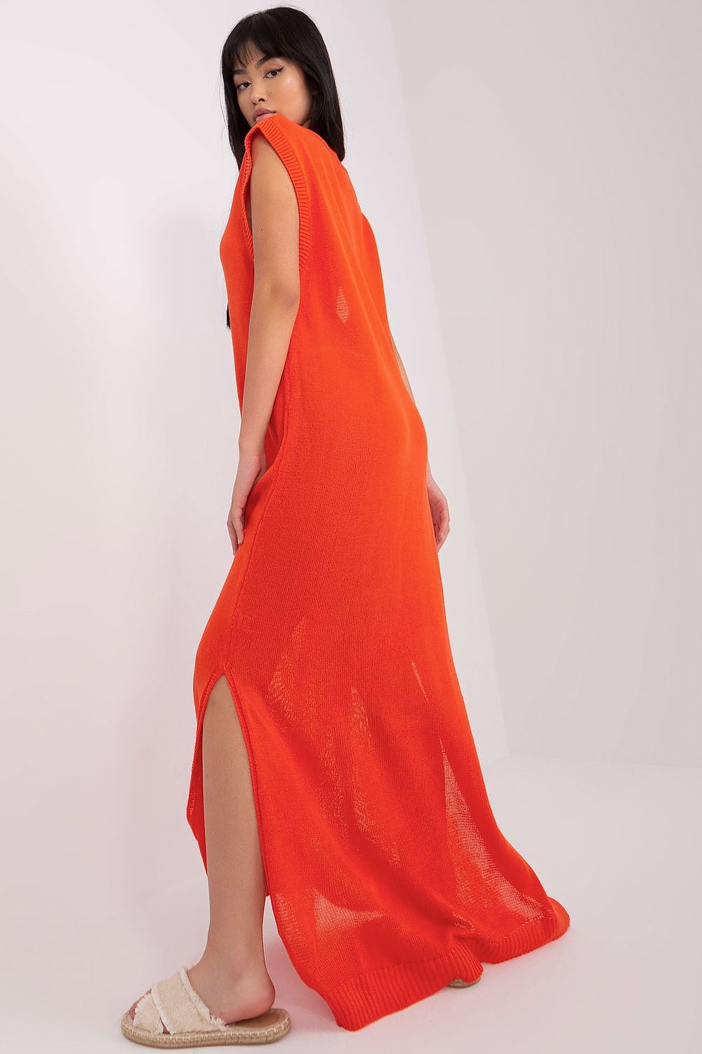 Detailed shot of the decorative side slits on the Badu luxury beach dress, highlighting its fashionable design features.