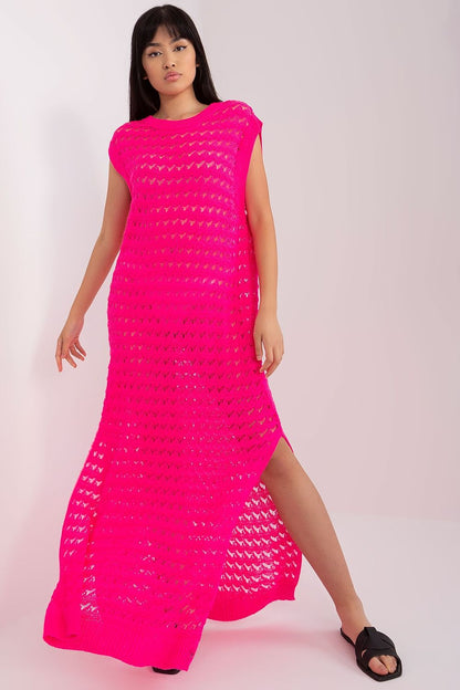 Luxury openwork long knit beach dress by Badu featuring decorative side slits, perfect for chic summer outings.