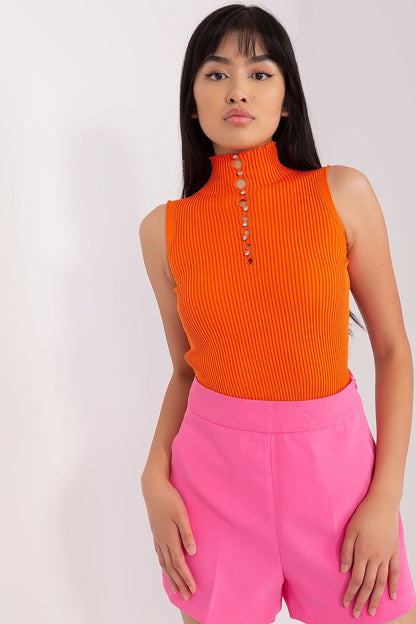 Badu's luxury sleeveless turtleneck blouse displayed elegantly, featuring shimmering decorative zircons on soft ribbed fabric.