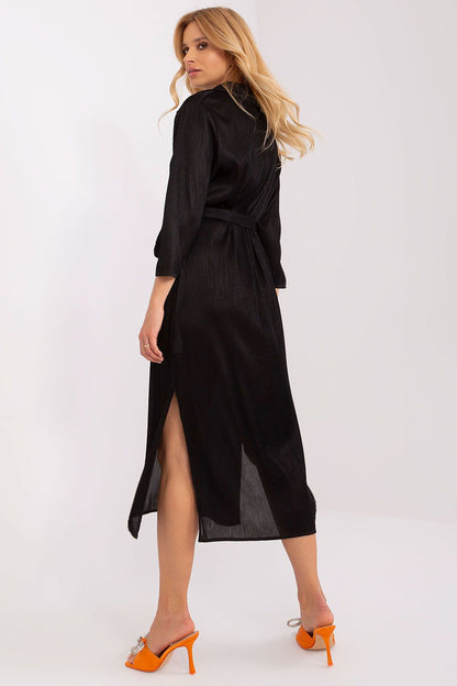 Detail of Lakerta daydress showcasing the sophisticated ribbed texture and flattering waist tie design for added elegance.