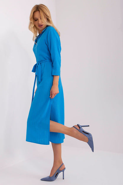 Luxurious straight cut dress by Lakerta, designed with 3/4 sleeves and a flattering waist belt, perfect for everyday elegance.