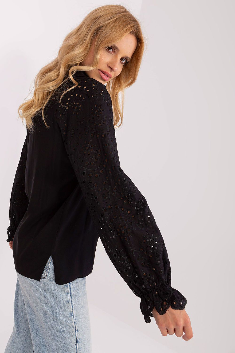 Elegant long-sleeved openwork viscose blouse by Lakerta, showcasing exquisite detail and perfect for any occasion.