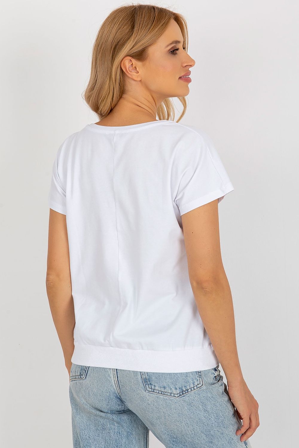 Model wearing the Rue Paris cotton blouse with short sleeves, demonstrating the flattering fit and luxurious fabric.