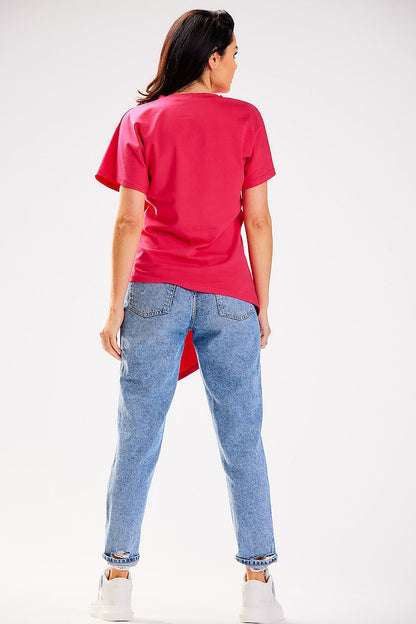 Stylish model wearing the Infinite You asymmetrical blouse, elegantly styled for a sophisticated look, reflecting contemporary fashion trends.