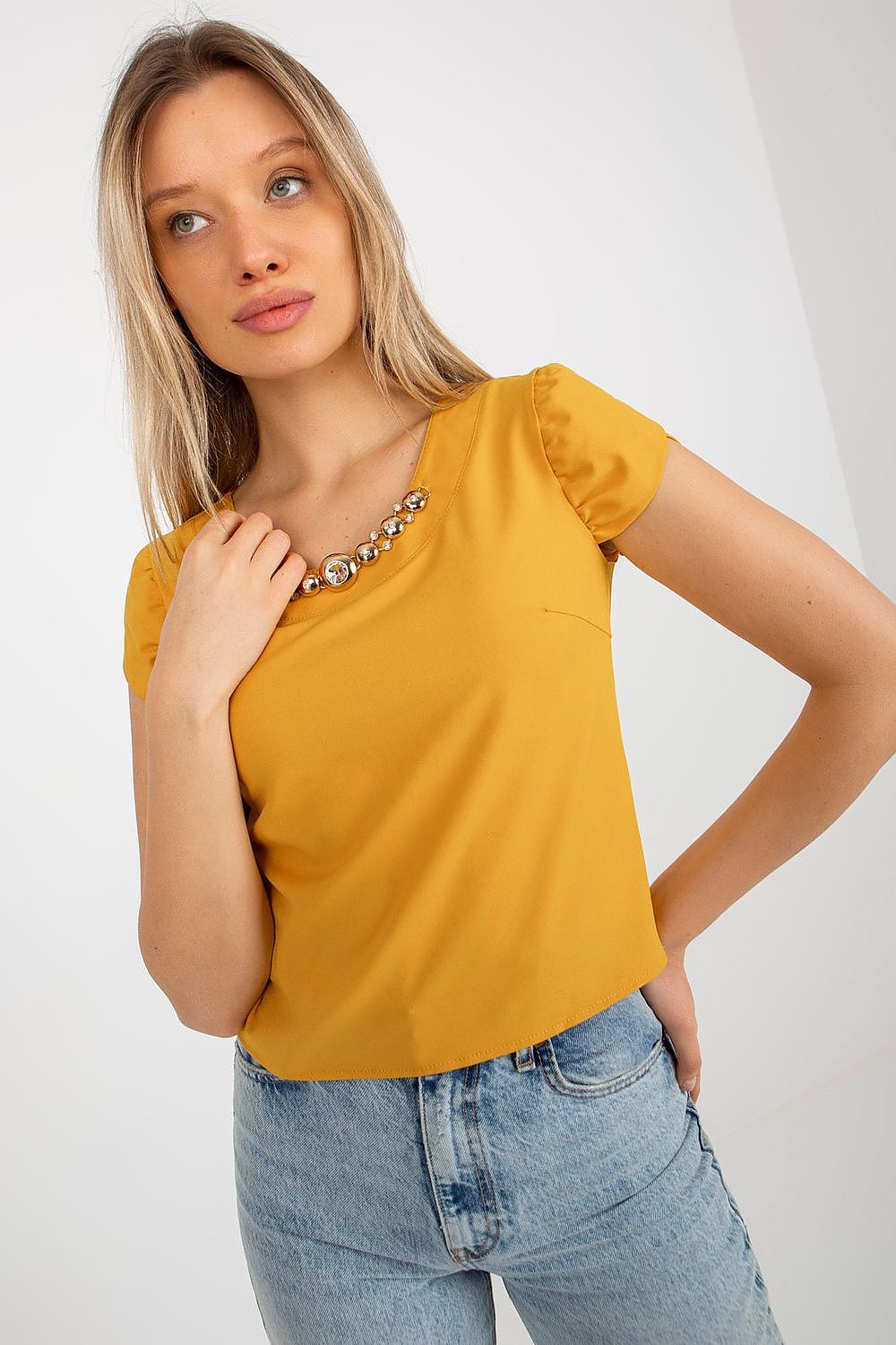Elegant Lakerta blouse with short sleeves and round neckline featuring a stunning jewelry embellishment, perfect for luxury fashion enthusiasts.