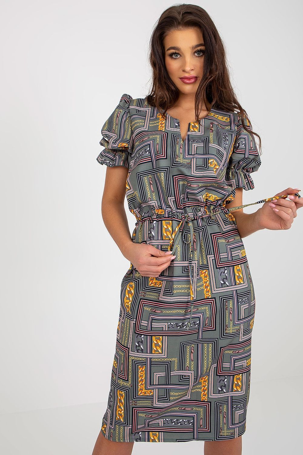 Side view of the Lakerta Daydress highlighting the buffet-style sleeves and flattering waist tie.