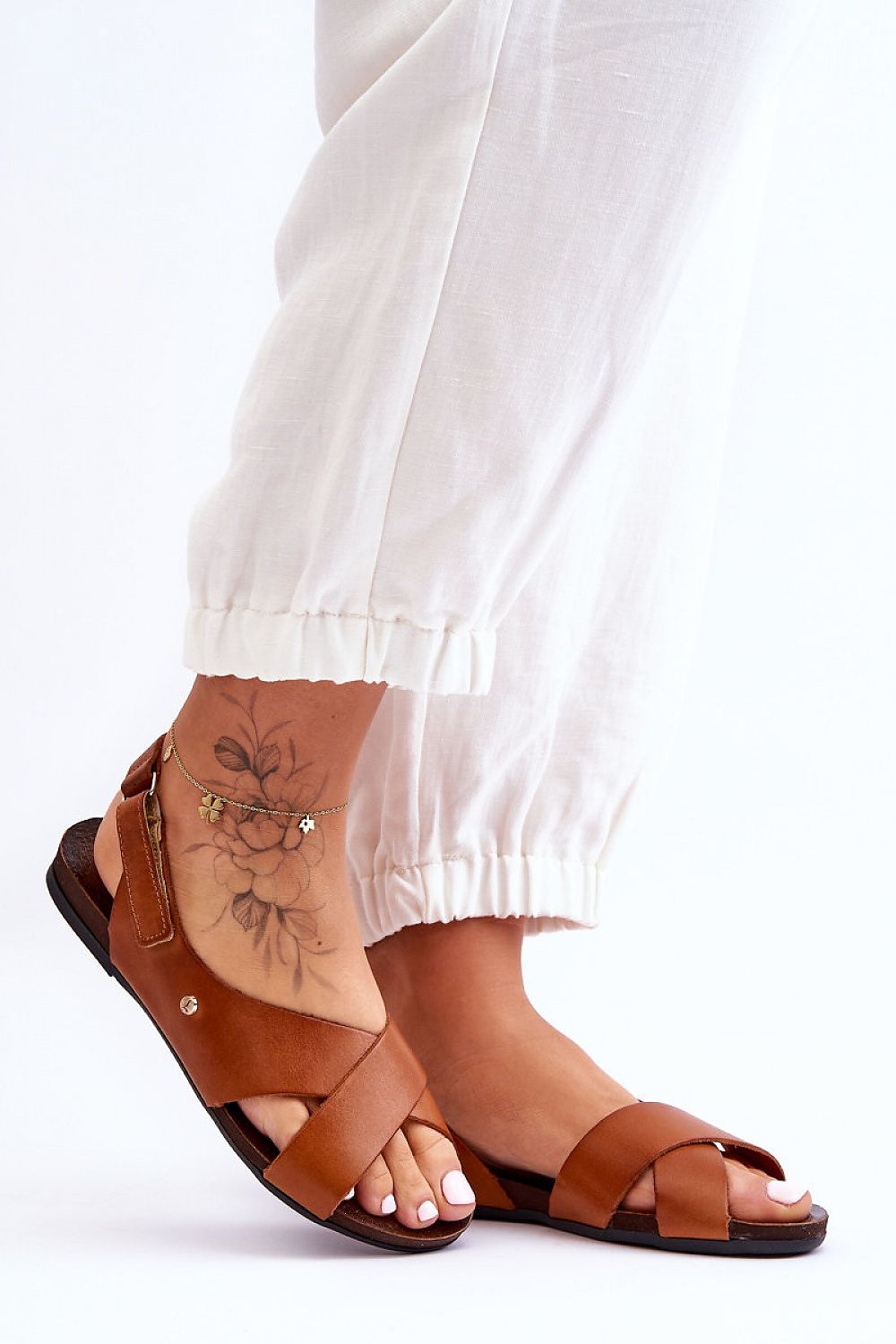Elegantly designed open heel and toe natural leather sandals from Step in Style, ideal for comfortable summer outings.