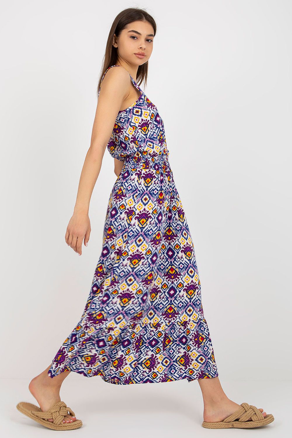 Model wearing Fresh Made's elegant long summer dress with thick straps and heart neckline in a stylish outdoor setting.