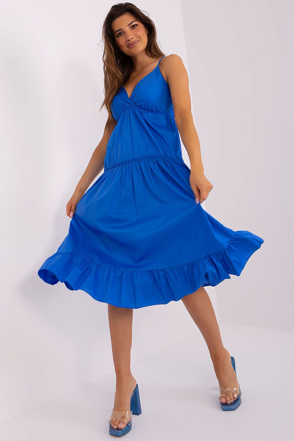 Och Bella luxurious women's summer dress featuring adjustable straps, an elegant flared silhouette, and decorative ruffle detailing.