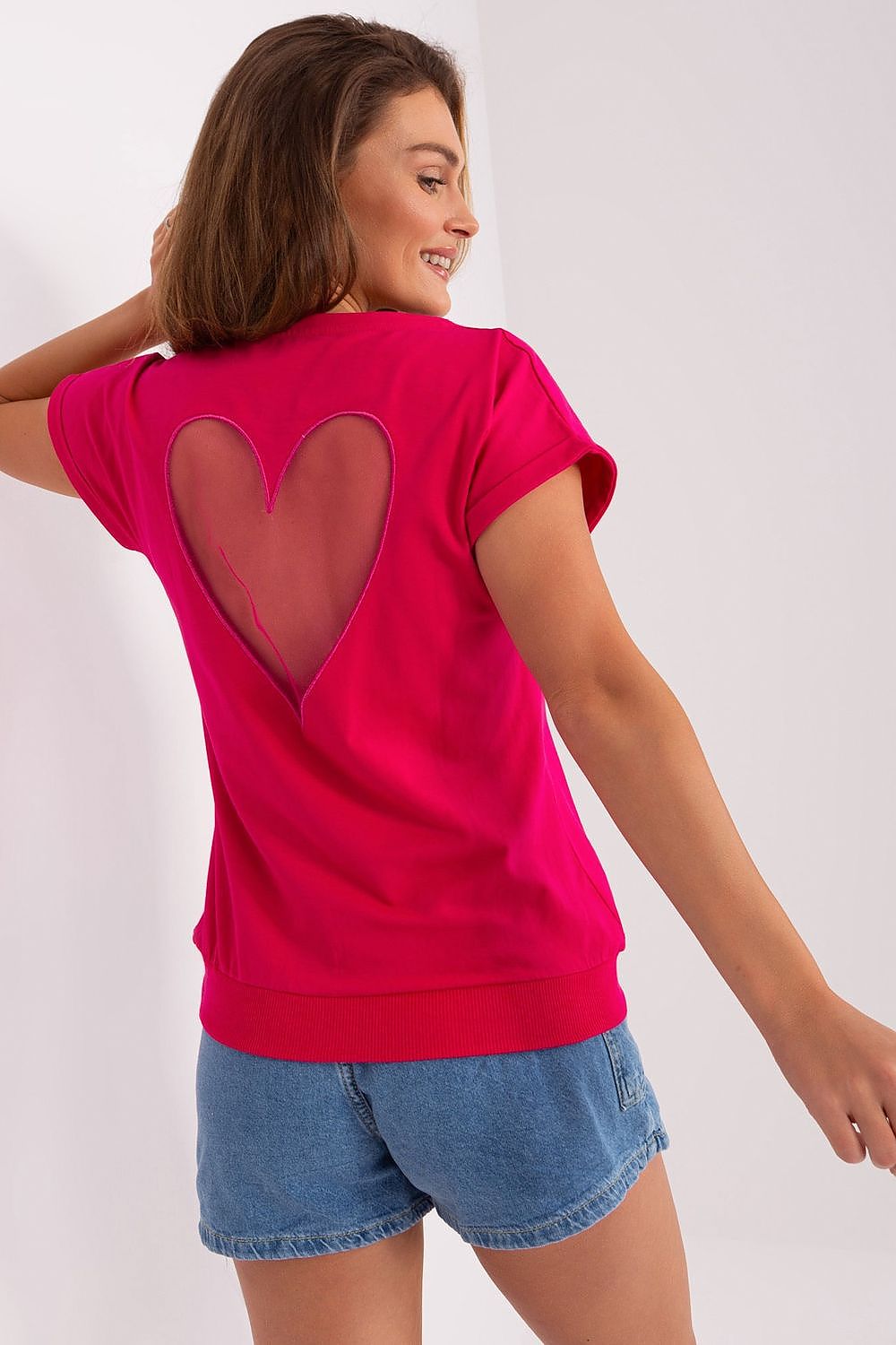 Close-up view of Relevance's stylish short sleeve blouse highlighting the intricate heart-shaped mesh insert, perfect for chic summer style.