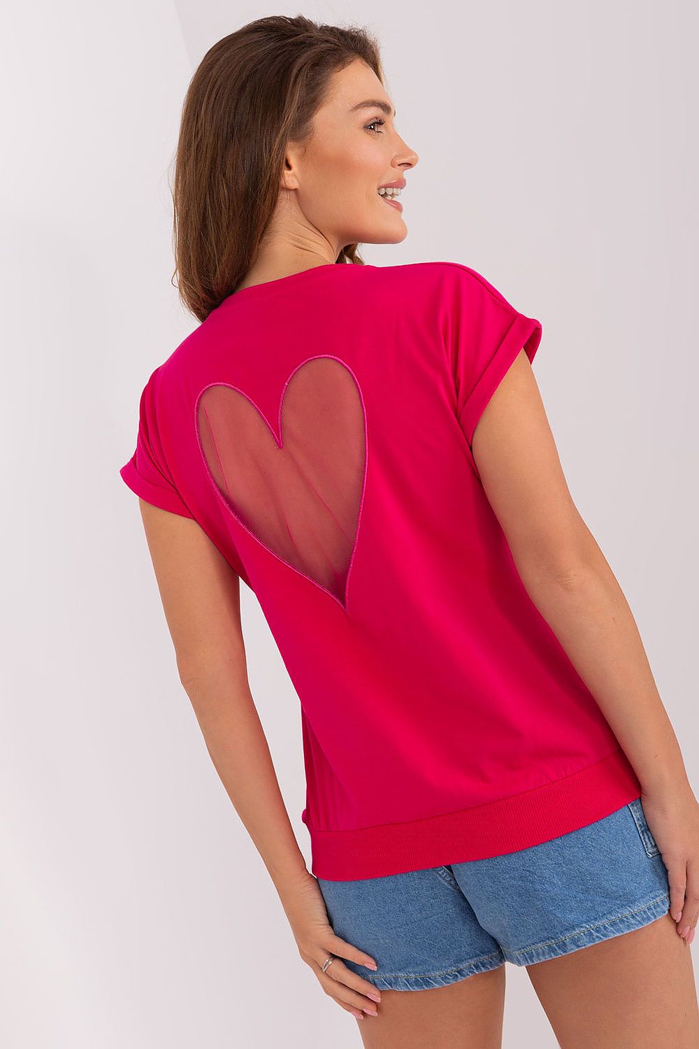 Back view of the elegant blouse by Relevance showcasing the decorative heart-shaped mesh insert, ideal for adding a touch of sophistication to your wardrobe.