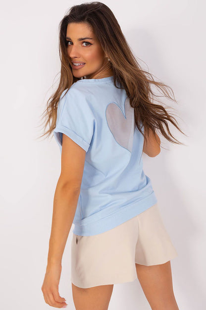 Model wearing the elegant short sleeve blouse by Relevance, designed with a chic heart-shaped mesh insert for a sophisticated look.