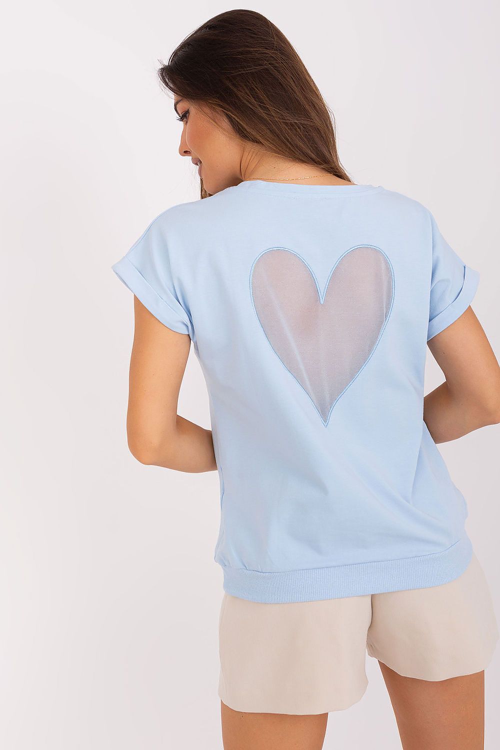 Back view of the Relevance blouse displaying the intricate heart-shaped mesh insert, perfect for a touch of elegance in casual and formal settings.
