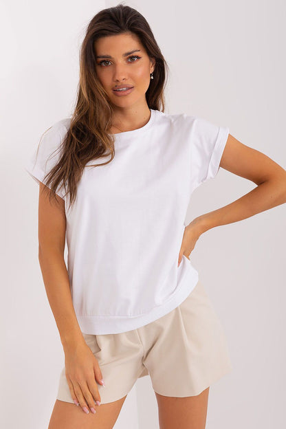 Close-up detail of the heart-shaped mesh insert on the back of an elegant short sleeve blouse by Relevance, showcasing intricate design in cotton and spandex fabric.
