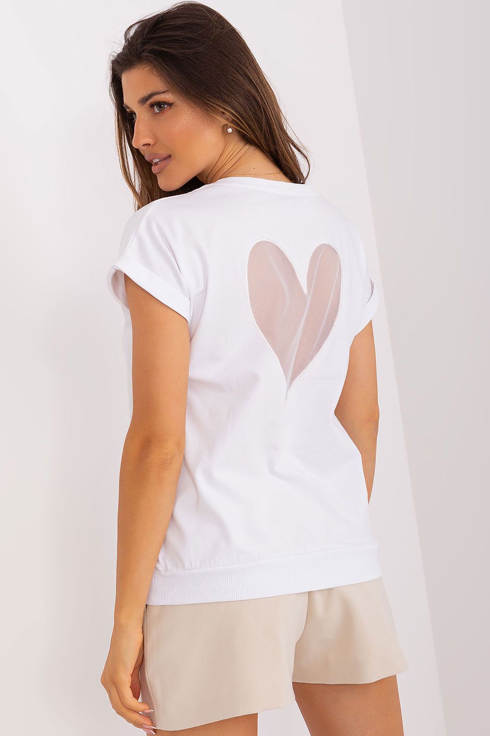 The elegant short sleeve blouse by Relevance laid flat, emphasizing its soft cotton and spandex blend, ideal for comfortable luxury wear.