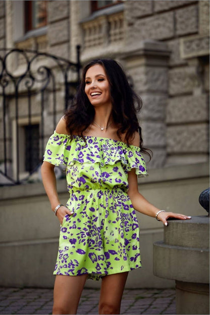 Elegant summer jumpsuit by Roco Fashion featuring a stylish Spanish neckline, delicate ruffles, and comfortable slip pockets.