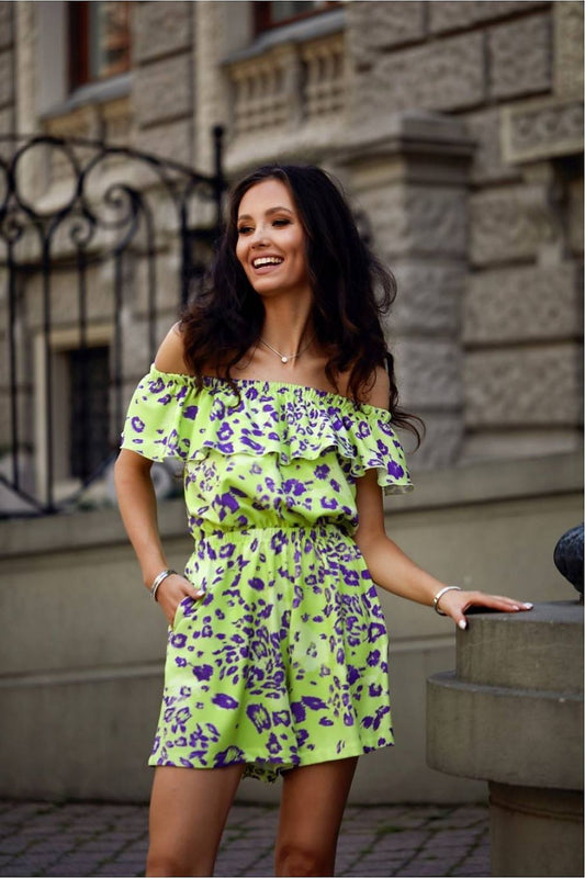 Elegant summer jumpsuit by Roco Fashion featuring a stylish Spanish neckline, delicate ruffles, and comfortable slip pockets.