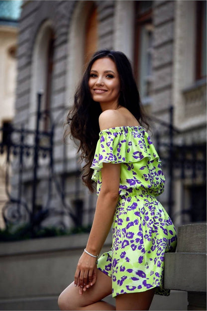 Chic Roco Fashion summer jumpsuit showcasing a flattering waist cut and short airy sleeves for a fashionable feminine look.