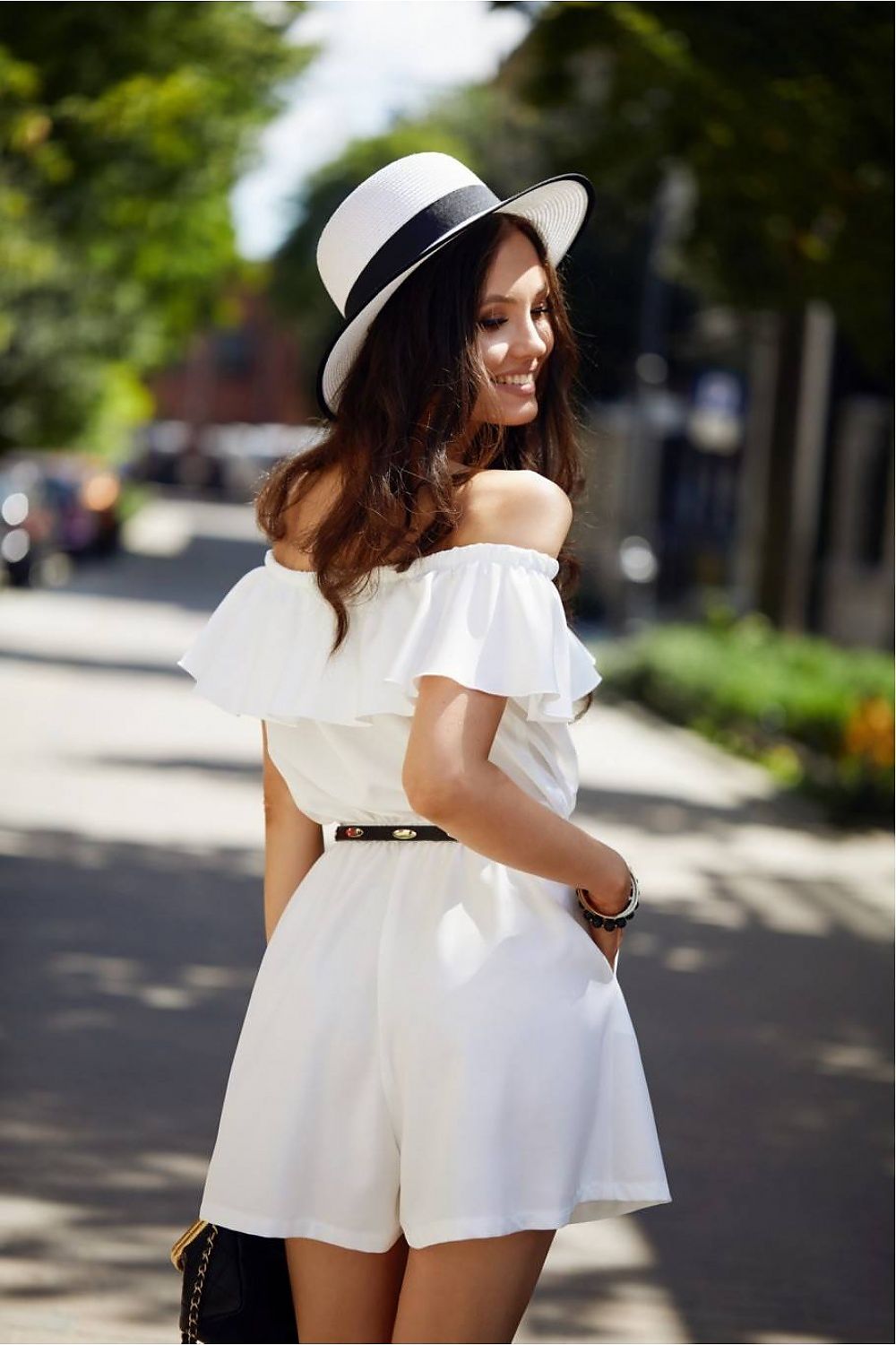 Luxury summer jumpsuit by Roco Fashion featuring an elegant ruffle and a stylish Spanish neckline, designed for feminine comfort with slip pockets.