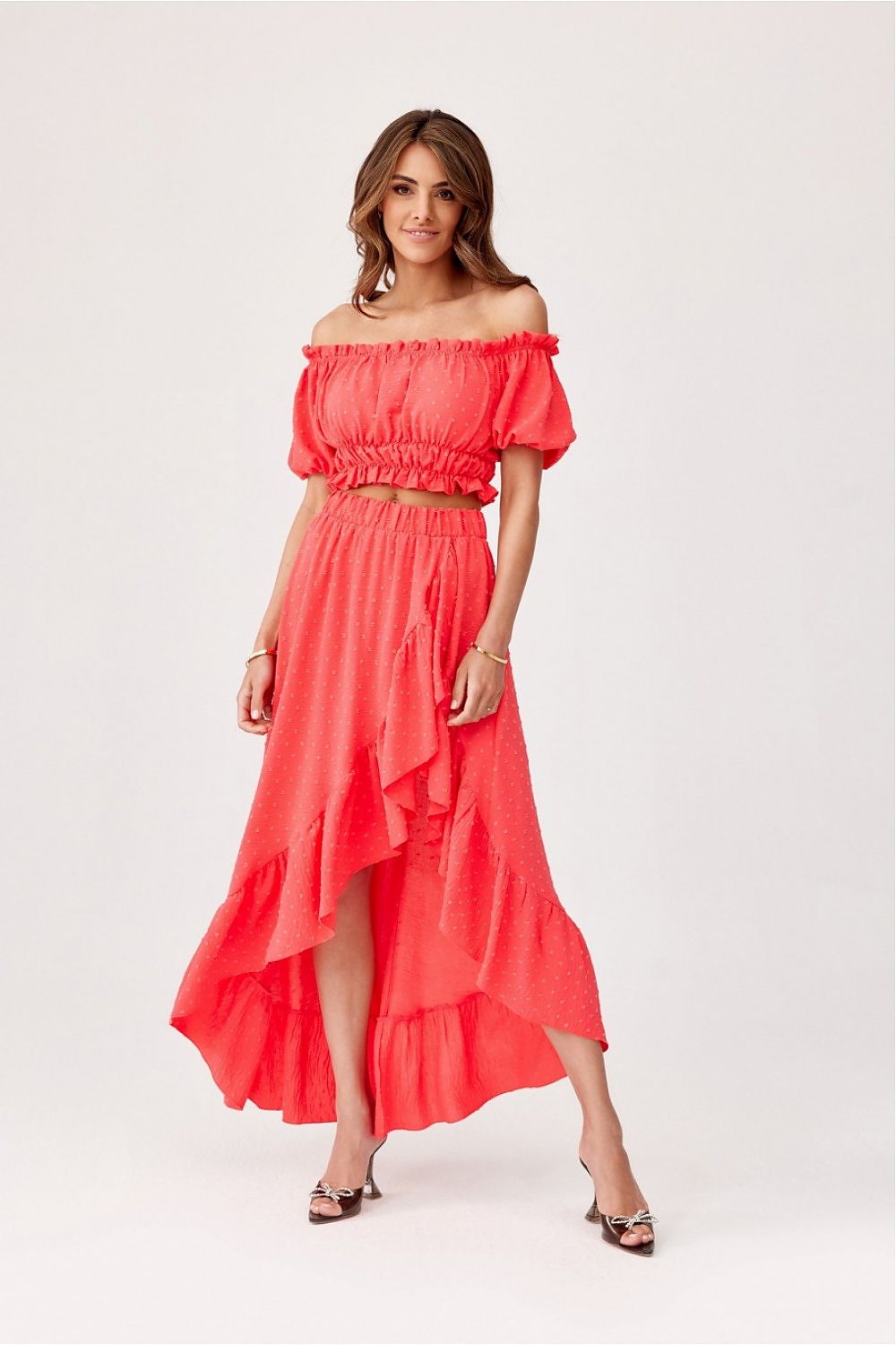 Model wearing Roco Fashion asymmetrical blouse and skirt set, exuding luxury and style perfect for daytime or evening occasions.