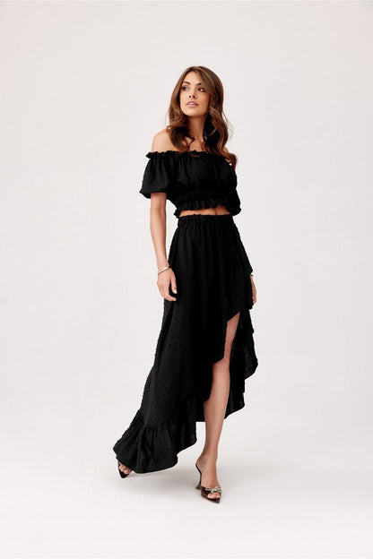 Roco Fashion stylish asymmetrical skirt featuring a ruffled front and elastic waistband for a luxurious fit.