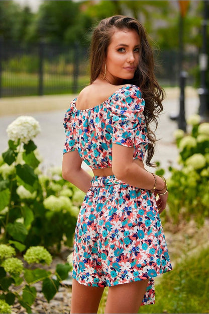 Luxury Roco Fashion women's summer set, stylishly designed with a short sleeve top and practical shorts, perfect for a chic summer look.