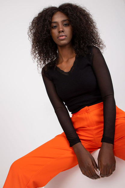 Elegant Rue Paris ribbed blouse showcasing transparent long sleeves and a heart neckline, perfect for sophisticated outfits.