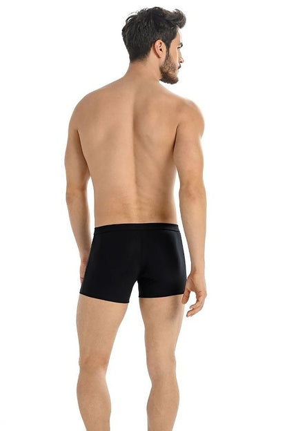 Back view of a model in Teyli black men's boxer shorts, emphasising perfect fit and elegant design.