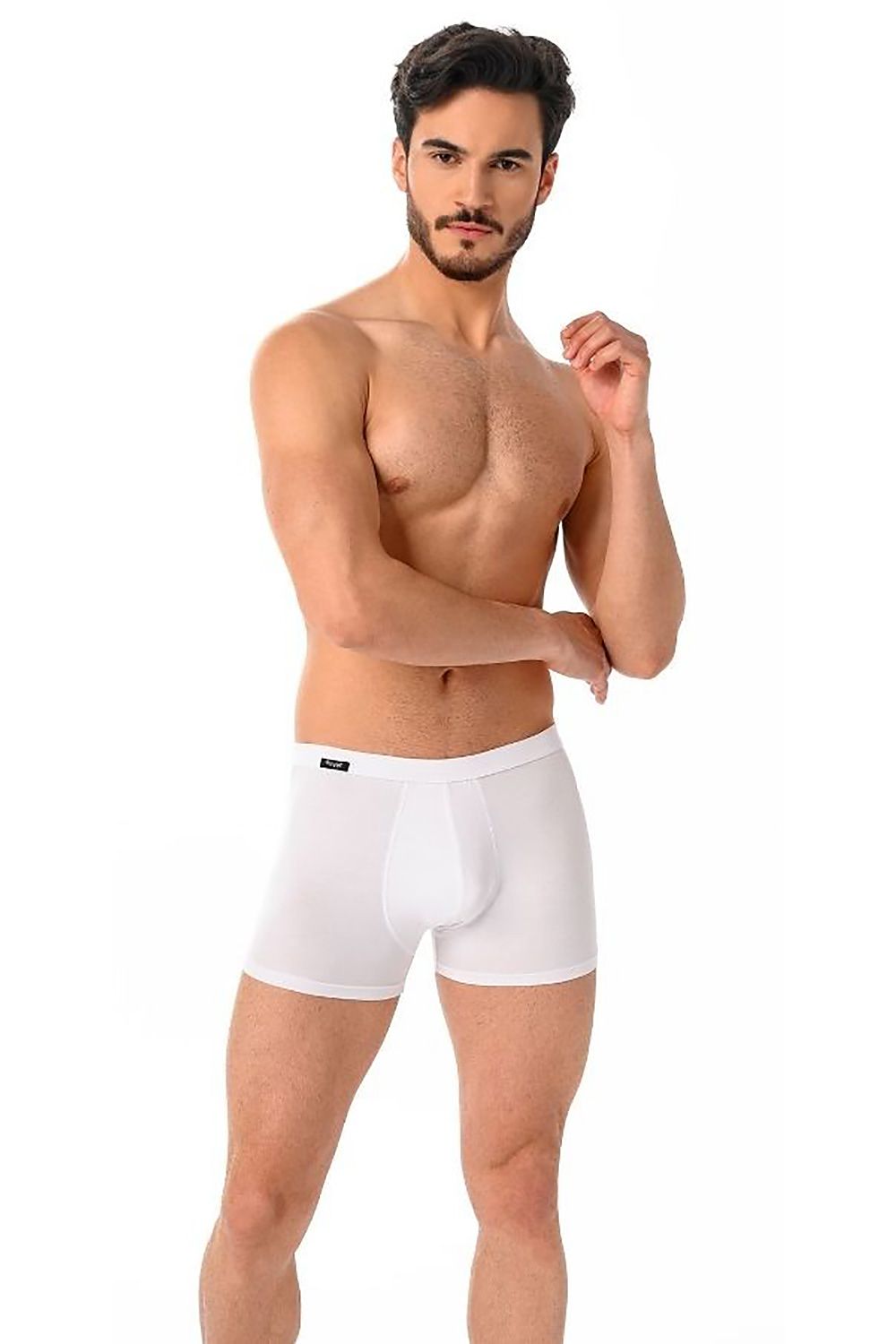 Model showcasing luxury white Teyli men's boxer shorts, emphasizing comfort and style in a fitted design.