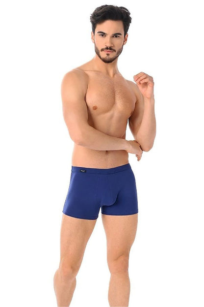Front view of a model wearing luxury Teyli men's navy boxer shorts, emphasizing durability and comfort.