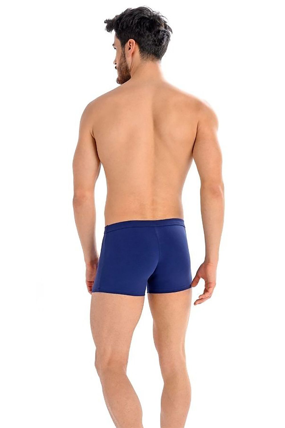 Back view of a model in luxury Teyli men's navy boxer shorts, showcasing the sleek design and tailored fit.