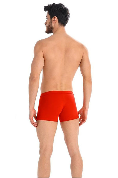 Back view of a male model wearing luxurious red boxer shorts from Teyli, showcasing a stylish and comfortable fit.