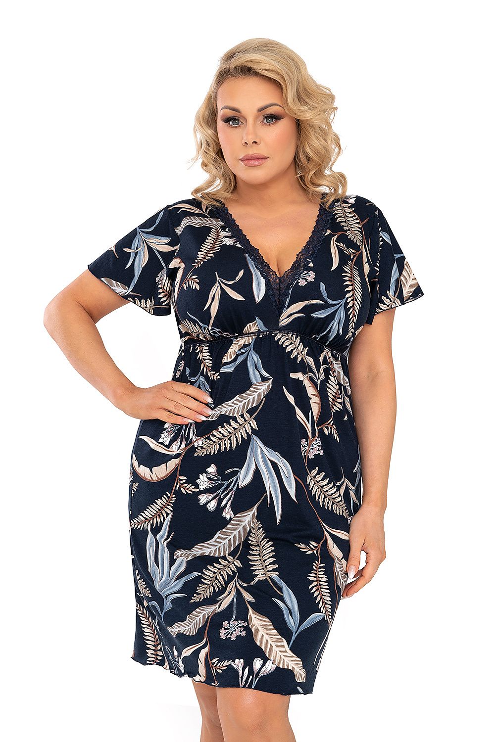 Luxurious navy blue nightshirt by Donna featuring delicate lace detail and a timeless floral pattern. Model showcases the elegant v-neck design and loose short sleeves.