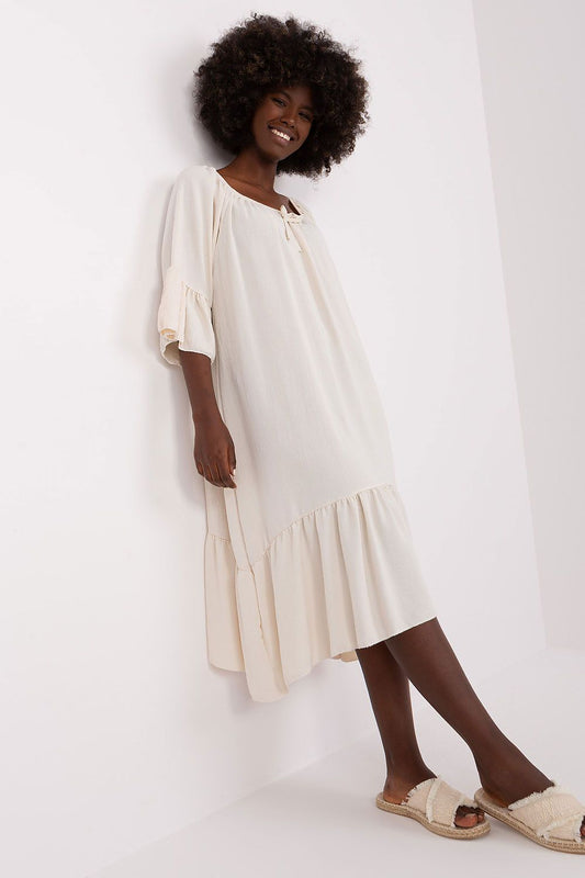 Stylish summer dress by Italy Moda, showcasing a frill design on the sleeves and hem for a sophisticated look.