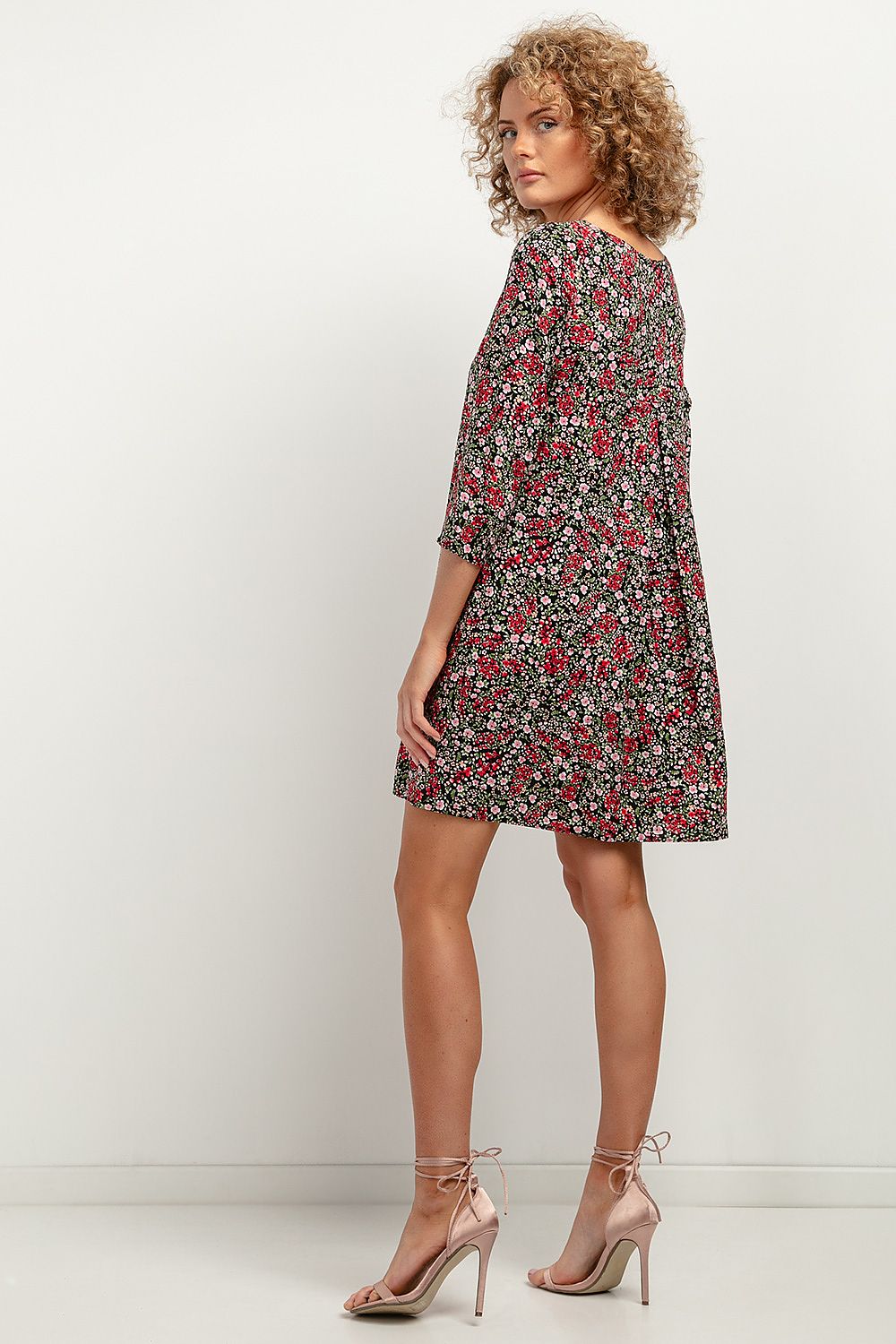 Model wearing the Tessita Viscose daydress featuring elbow-length sleeves and a flowing silhouette, exemplifying elegance and comfort for any event.