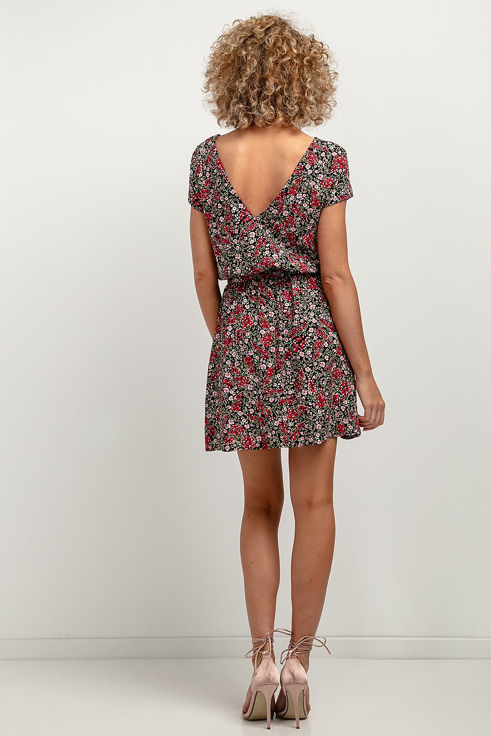 Model wearing the Elegant Floral Daydress by Tessita, exemplifying stylish elegance in viscose fabric, perfect for any occasion.