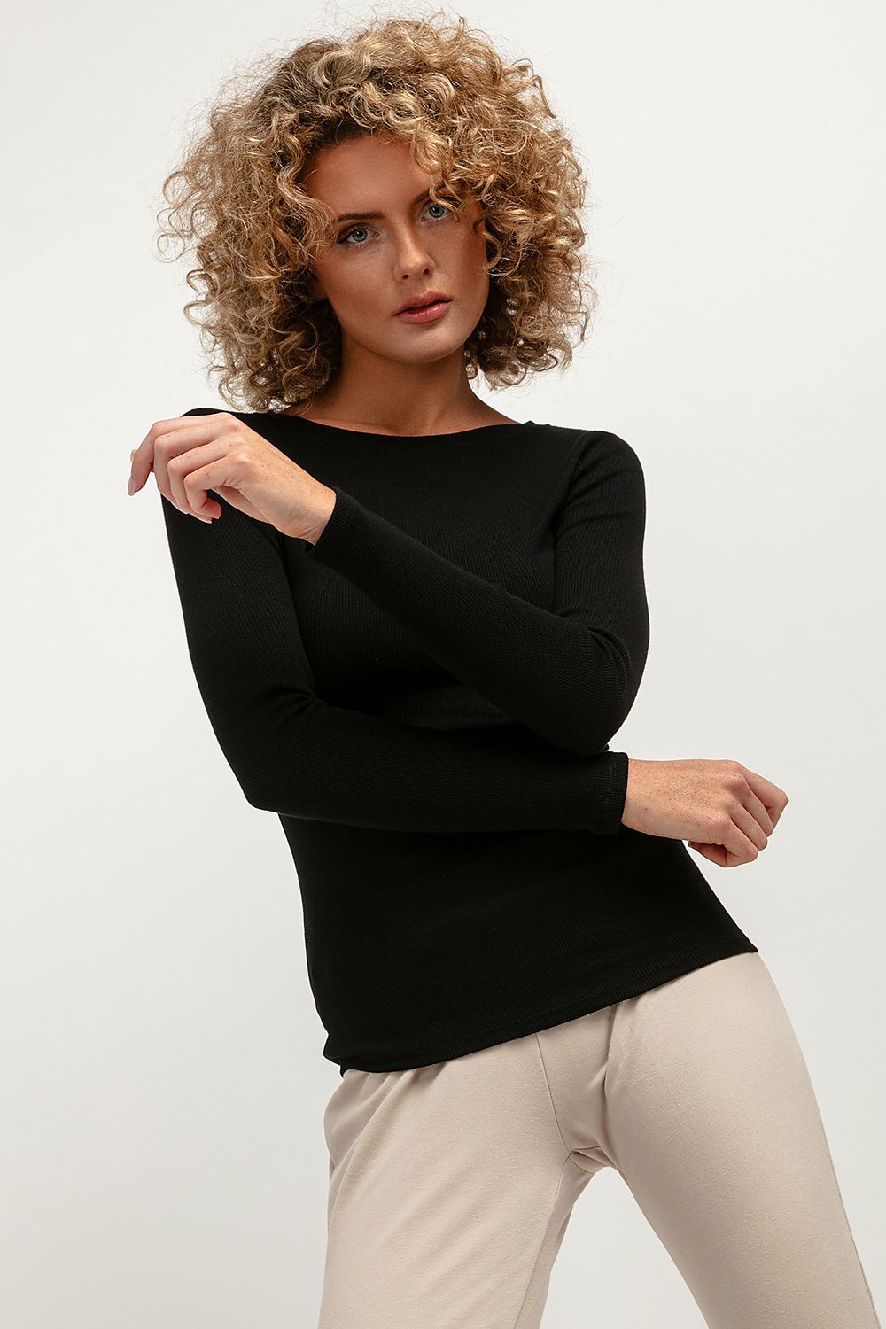 Elegant fitted long-sleeve ribbed blouse by Tessita featuring a chic boat neckline, perfect for stylish layering and versatile wear.