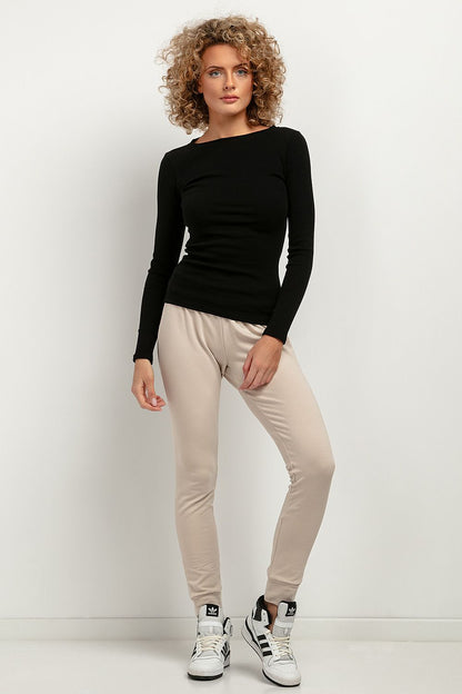 Close-up texture of the luxurious ribbed fabric used in the Tessita fitted blouse, highlighting its soft cotton and spandex blend.