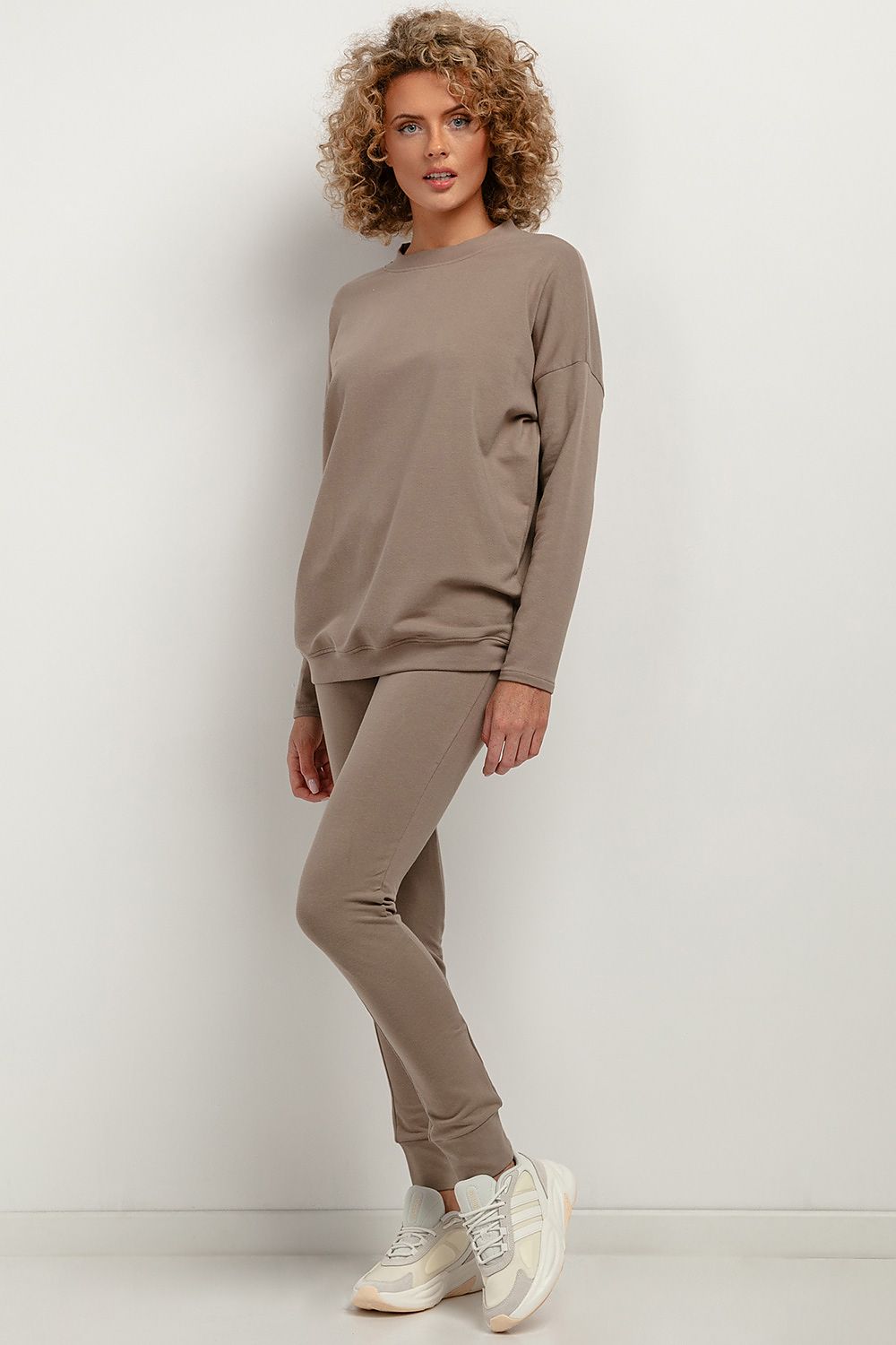 Tessita stylish soft knit trousers displayed in a chic setting, emphasizing their contemporary design and elegant fit.