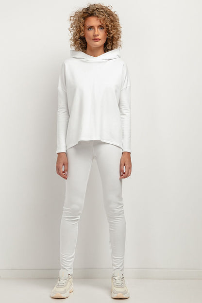 Model wearing Tessita Women's Leggings, emphasizing the flattering silhouette and high-quality sweatshirt knit fabric.