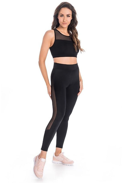 Sculpting high-waisted black leggings with mesh design for women, crafted by Teyli, providing a luxurious compression fit and flattering silhouette.