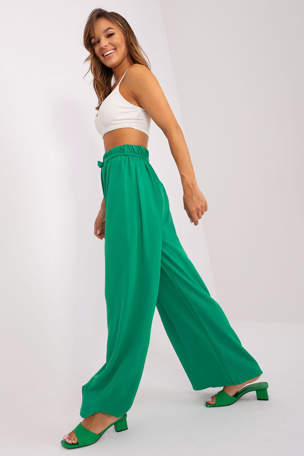 Elegant summer trousers for women by Och Bella featuring wide legs and sophisticated waist binding, perfect for casual yet luxurious occasions.