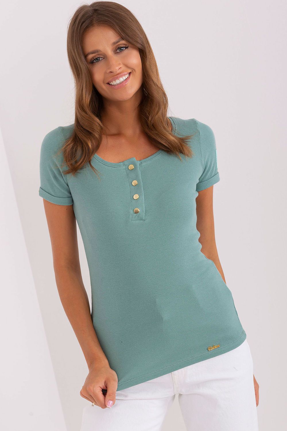 Chic Och Bella ribbed blouse with decorative snaps, ideal for a polished look, accentuating curves with its tailored fit and short sleeves.