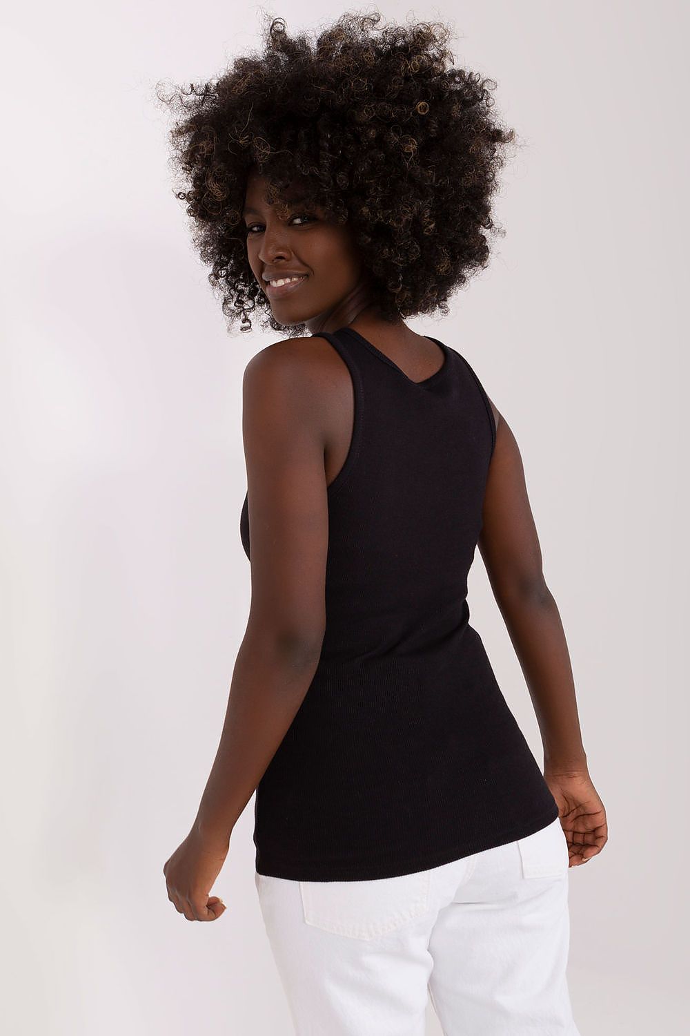 Model wearing the Och Bella Ribbed Strapless T-shirt, exuding elegance and charm in a luxurious casual style.