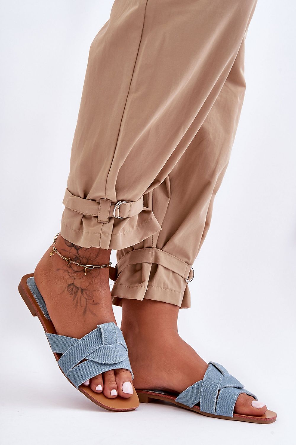 Sophisticated women's interlaced strap flip-flops ideal for sunny days, available from Step in Style.