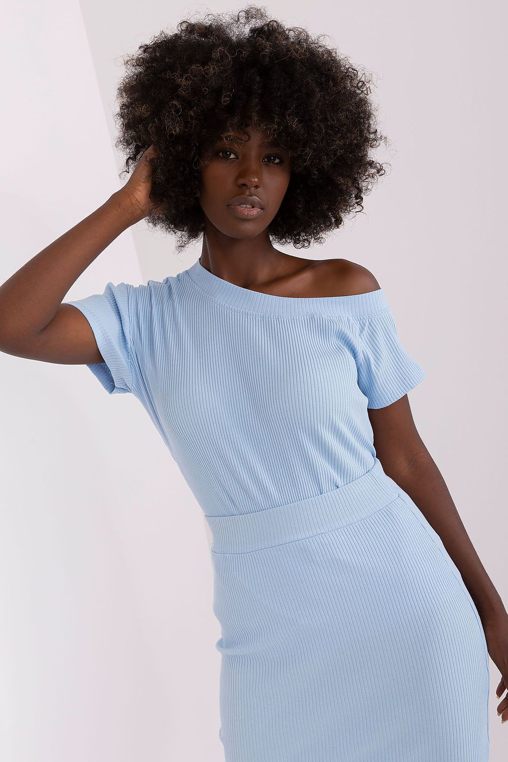 Fashionable Relevance blouse displayed on a model, illustrating the perfect fit and contemporary elegance of short sleeves.