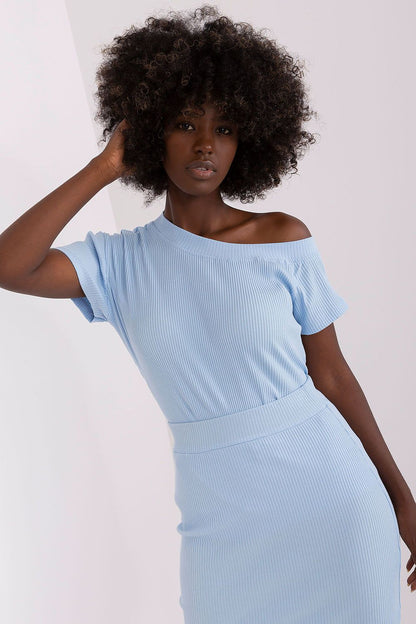 Fashionable Relevance blouse displayed on a model, illustrating the perfect fit and contemporary elegance of short sleeves.