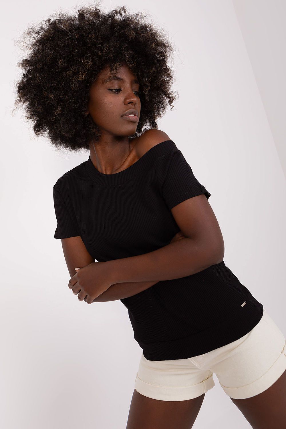 Close-up view of the premium ribbed fabric and symmetrical neckline on the short sleeve blouse by Relevance, crafted from cotton and spandex.