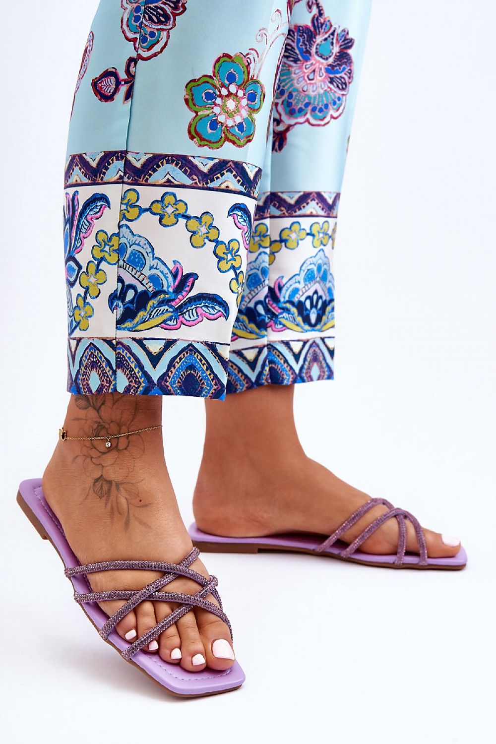 Top view of Elegant Women's Flip-Flops with Rhinestone Decorations by Step in Style, highlighting the intricate strap design and premium eco-leather footbed.