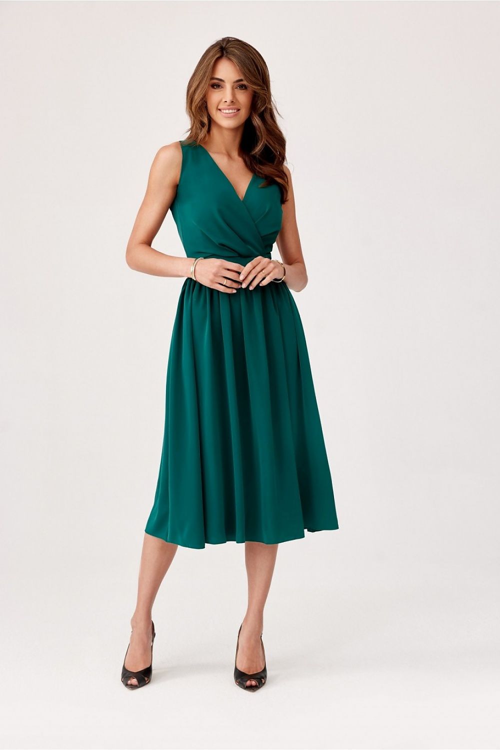 Model wearing the sophisticated midi cocktail dress by Roco Fashion, radiating grace and charm for formal outings.